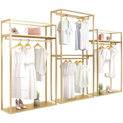 China Clothing Store Boutique Garment Shelf Cloth Display Clothes Rack Shops Chrome Stainless Steel Gold Metal Clothing Rack For Store for sale