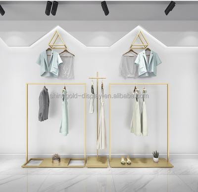 China Clothes Shop Boutique Floor Standing Wholesale Clothes Stores Metal Clothing Rack Wall With Shelf for sale