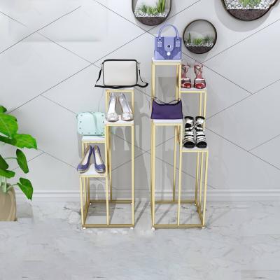 China Shops Luxury Clothing Display Rack Mall Window Retail Store Gold Metal Shoes Bag Hat Flower Floor Rack Showcase Display Rack for sale