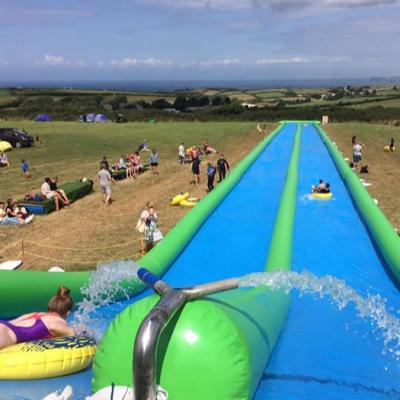 China PVC Tarpaulin 100m Long Inflatable City Slide / Inflatable Slide And Slide For Adults for sale