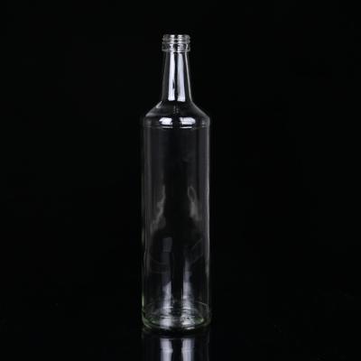 China Beverage 620ml White Round Rum Liquor Glass Bottle for sale