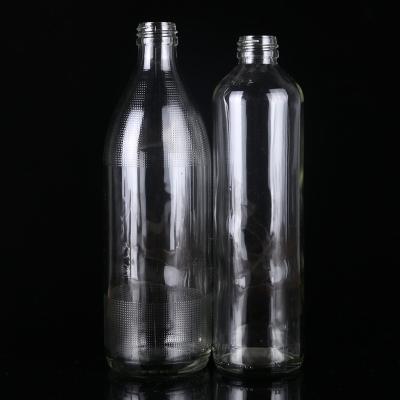 China Wholesale Reusable Milk Round Reusable Wine Drinking Water Frying Oil Frying Oil Beer Glass Clear Fancy Bottle With Cap for sale