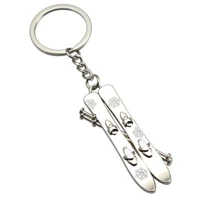 China 2022 luxury custom winter sports geely souvenir white metal logo ski key chain for sale