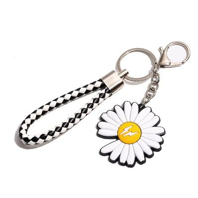 China Luxury Luxury Flower Shaped Black White Silicone Daisy Bulb Small Buckle Or Spring Hook Key Chain Ring With Leather Lanyard for sale