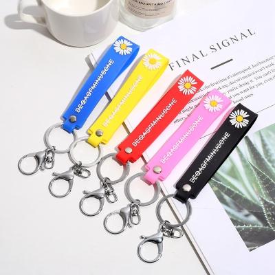 China Luxury Custom Small Daisy Soft Plastic Flower Bracelet Key Ring Chain Spring With Letter for sale