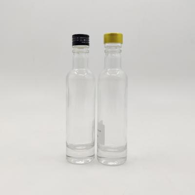 China Beverage 120ml Clear Long Neck Spirit Glass Bottle With Silver Aluminum Screw Cap for sale