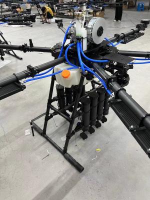 China UAV de quatro eixos com quatro rotores FOC Drive 3090 hélice dobrável Drone amarrado com bobina de mangueira auto-retrátil Bobina de cabo à venda