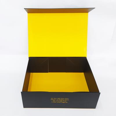 China Recycled Materials Elegant Folding Paper Box With Ribbon Handles Yellow Color Packaging Boxes For Clothing for sale