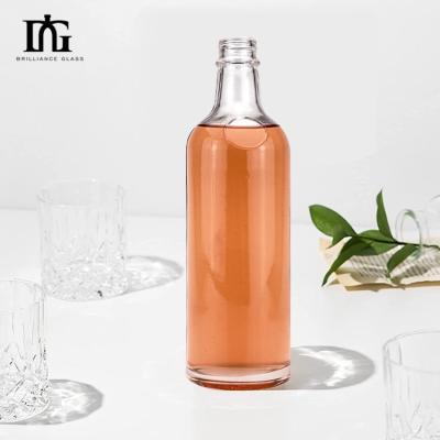 China Acceptable OEM/ODM 550ml Clear Screw Cap Bottle for Gin Rum Wine Alcohol Glass Bottle for sale