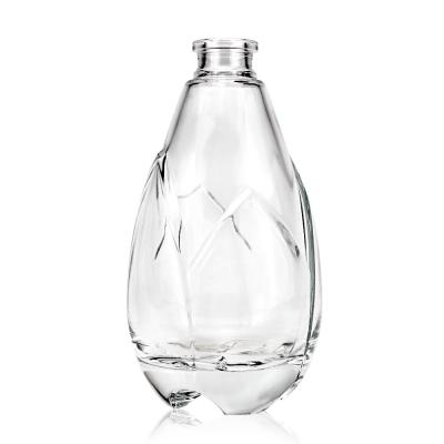 China 500ml Engraving Surface Unique Bottle for Liquor Spirits Glass Bottle Beverage Cork for sale