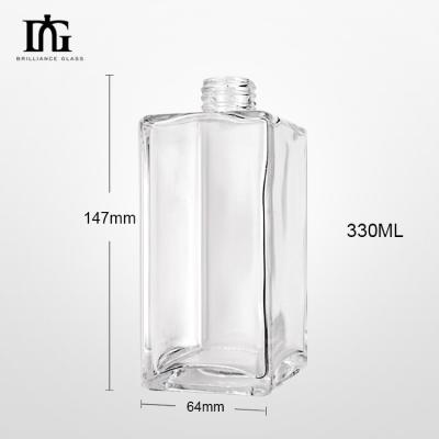 China Custom Round Shape 700ml Transparent Empty Glass Liquor Bottle for Whisky Vodka Tequila for sale