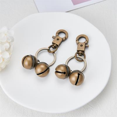 China China Simple Retro Style Brass Dog Buckle Plus Flat Ring Plus Bell Compound Key Chain for sale