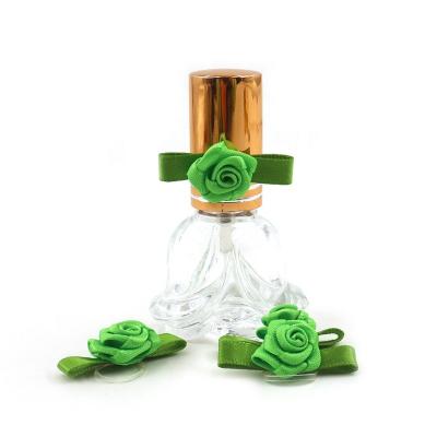 China Custom pre-made bright color fastness sale various satin flower rose decoration perfume bottle ribbon bows for sale