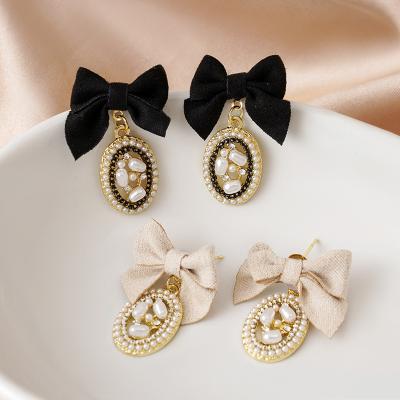 China CLASSIC New Arrival 925 Needle Pearl Rhinestone Silver Stud Earrings Bow Butterfly Stud Earrings for sale