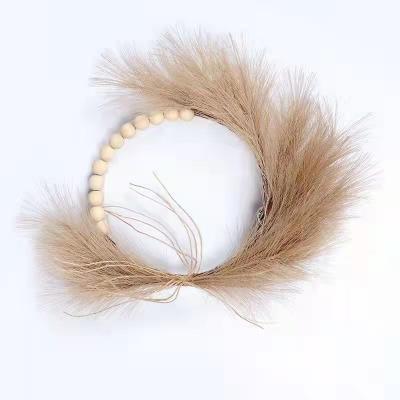 China Hot Wedding Decor Amazon Design Wedding Decor Dried Pampas Garland Wreath With Wooden Beads Artificial Pampas Grass Wood Bead For Sale for sale