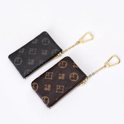 China Trendy Leather Mini Coin Purse Fashion Change Bag Card Holder Vegan With Key Chain Zipper for sale