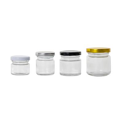 China Honey Packaging Customized Mini Glass Honey Jars Round Glass Mason Jars 25g 50g 75g 100g Food Storage With Lids for sale