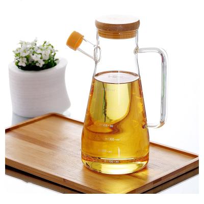 China Heatable Popular Kitchenware Empty Bottle For Olive Oil High End Glass 650ml 900ml Frying Oil Bottles With Handle for sale