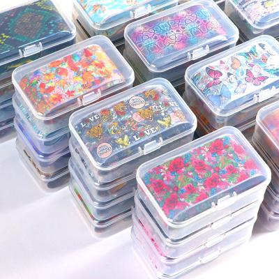 China 84 Designer Nail Foil 4x50cm Foil Nail Art Stickers Butterfly Christmas Trendy Holographic Paper Decals Stick Transfer Nail Foil for sale