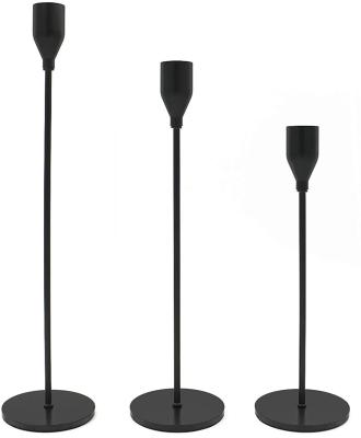 China Modern Eye-Catching Black Tall Candle Holder Metal Candlestick Home Wedding Decorative Stand for sale