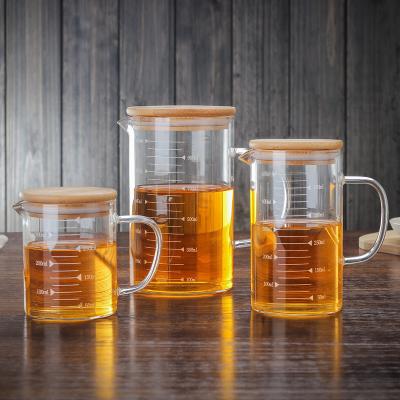 China Art Decor pyrex glass measuring cup jug scale cup heat resistant glass 350ml/500ml/1000ml with cover bamboo lid for sale