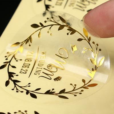 China Waterproof Vinyl Sticker Label Clear Sticker Gold Foil Hot Stamping Sticker Waterproof for sale