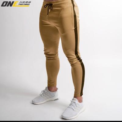 China Anti-wrinkle foreign trade sports pants running pants fitness training bottom European and American slim casual pants small leg pants for sale