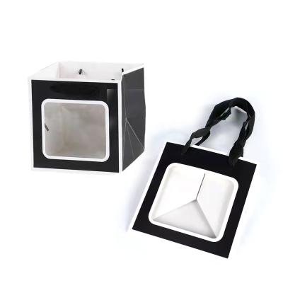 China Recycled materials square clear window display gift portable paper bag with handle for flower gifts packaging bags for sale