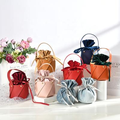 China Gift PU Leather Soft Gifts Bags With Handle Candy Gift Favors Handbag Basket Bags for sale