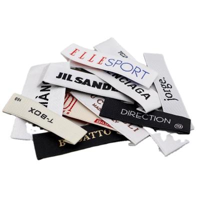 China Viable Customized Color Tagless Brand Fabrics Flat Thermal Iron On Small Woven Labels For Apparel Neck for sale