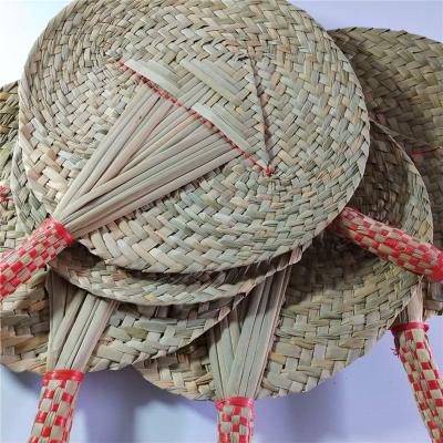 China Wholesale Europe Natural Grass Woven Grass Fan Woven Craft Summer Cool Fan Handle Fine Red Fan for sale