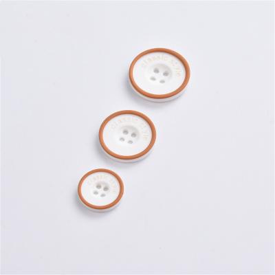 China 2020 viable four eyes resin buttons white bottom buttons accessories chocolate edge letter buttons wholesale for sale