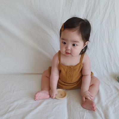 China 2021 new cotton solid color wholesale hot sale sling baby romper infant sleeveless cotton clothes baby romper pajamas for sale