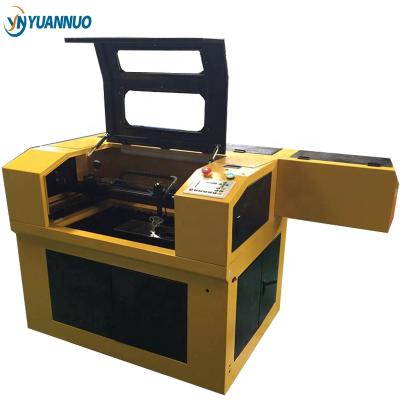 China Laser Engraving YN6040 Coconut Shell Laser Cutting And Glass Engraving Machine for sale