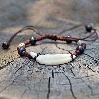 China Natural Vintage Faux Wolf Tooth Hand Rope Bracelet Men Tibet Amulet Fang Bracelet Women Primitive Tribes Bone Jewelry Bracelet YS001 for sale