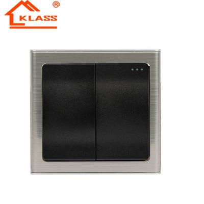 China PC 250V 2gang 1 Way Black Color Acrylic Stainless Steel Framed Building Electric Light Wall Switch Socket for sale