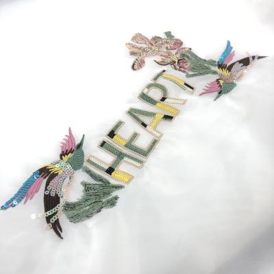 China Sustainable New Design Custom Bird Letters Sequin Embroidered Patch For Clothing for sale