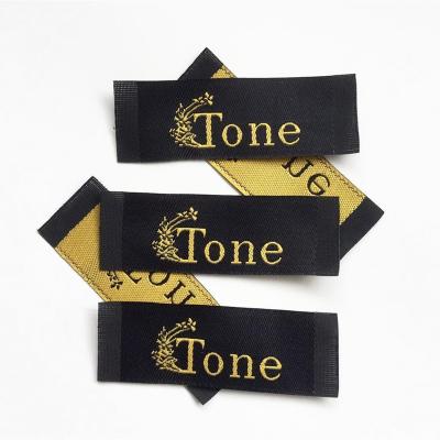 China Viable High Quality Custom Garment Manufacturer Label Gold Metallic Woven Label for Clothing Collar for sale