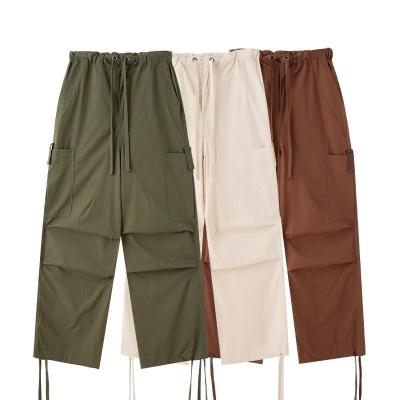 China Anti-wrinkle Drawstring Retro Loose Cargo Pants Big Pocket Straight-leg Personality Women's Casual Pants for sale