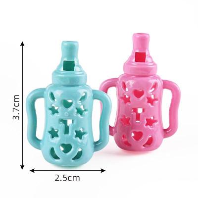 China Wholesale Promotional China PP Plastic Small Baby Bottle Shaped Whistle For 45mm Capsule Kids Plastic Whistle Toys for sale