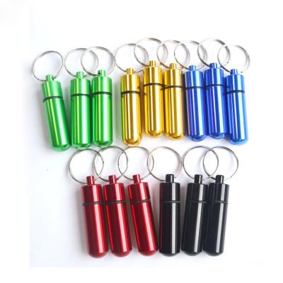 China 50*14mm Custom Waterproof Pill Box Stash Drug Container Pill Box Key Chain Pill Case Keychain Aluminum Key Chain With Key Ring for sale