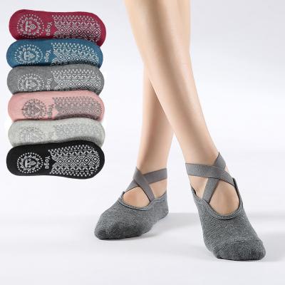 China Breathable yoga socks for women non-slip grips and straps, ideal for indoor activity barefoot workout for sale