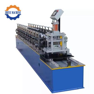 China PLC Automatic High Quality Galvanized Sheet Metal Roller Shutter Door Roll Forming Machine Te koop