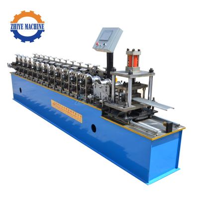 China Door garage rolling door used steel strip roller shutter door slat roll forming machine for sale en venta