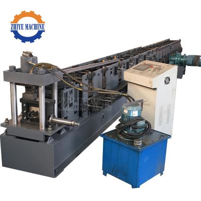 중국 Shelf baffle roll forming machine sheet metal cutting and bending steel stud support shelf cold roll forming machine price 판매용