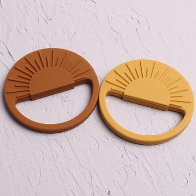 China Soft Infant Nursing Toy BPA Free Pendant Chewing Sensory Teether Sun Shape Silicone Teether Toys for sale