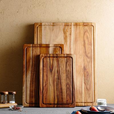 China Viable Wholesale Custom Large Rectangle Reversible Acacia Wood Bread Cut Cutting Board with Juice Groove for sale