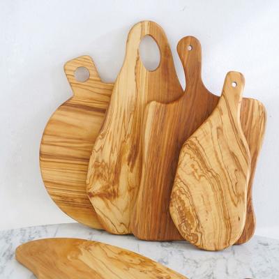 China Viable Customized Real Olive Wood Irregular Logo Shape Fruit Cake Bread Meat Serving Cutting Board With Handle for sale