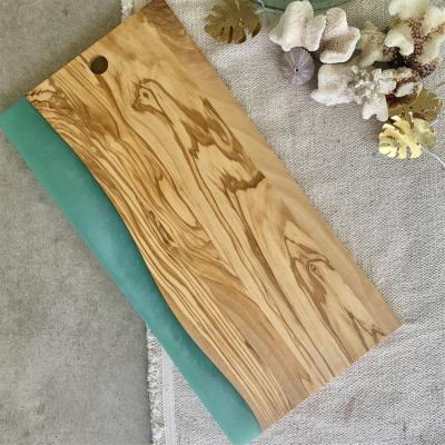 China Viable Shape Custom Color Design Natural Olive Wood Cheese Fruits Vegetables Epoxy Resin Cutting Serving Cutting Board for sale