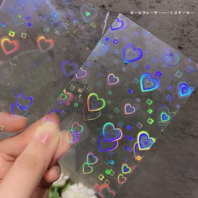 China Festival Holiday Finger Decoration Oosi De Super Shiny Laser Rainbow Colors DIY Heart Design Decorative Nail Art Sticker Self Adhesive for sale